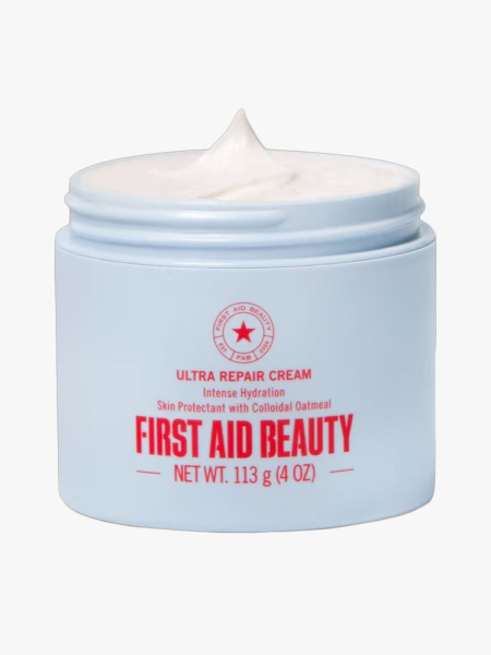 First Aid Beauty Ultra Repair Cream in branded tub component on a light gray background